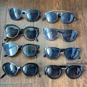 8 pairs of black sunglasses